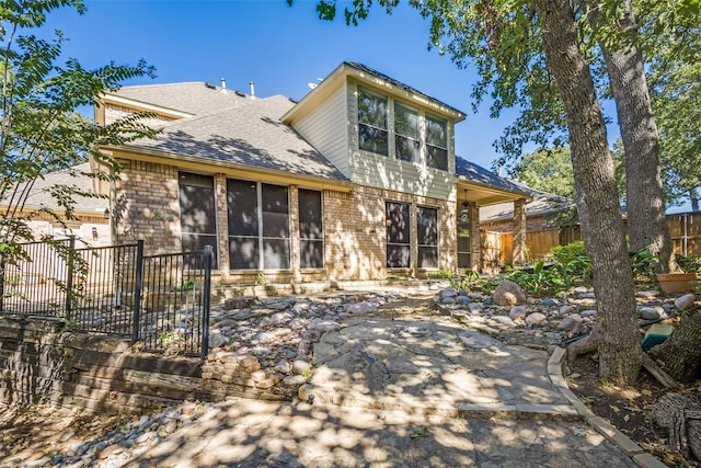 view of front of house featuring a sunroom