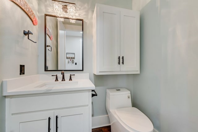 bathroom featuring vanity and toilet