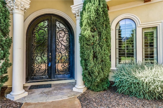 view of exterior entry featuring french doors