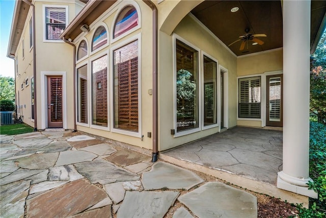 view of patio with central AC unit and ceiling fan