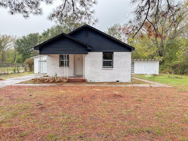 view of front of house with a garage and a front yard