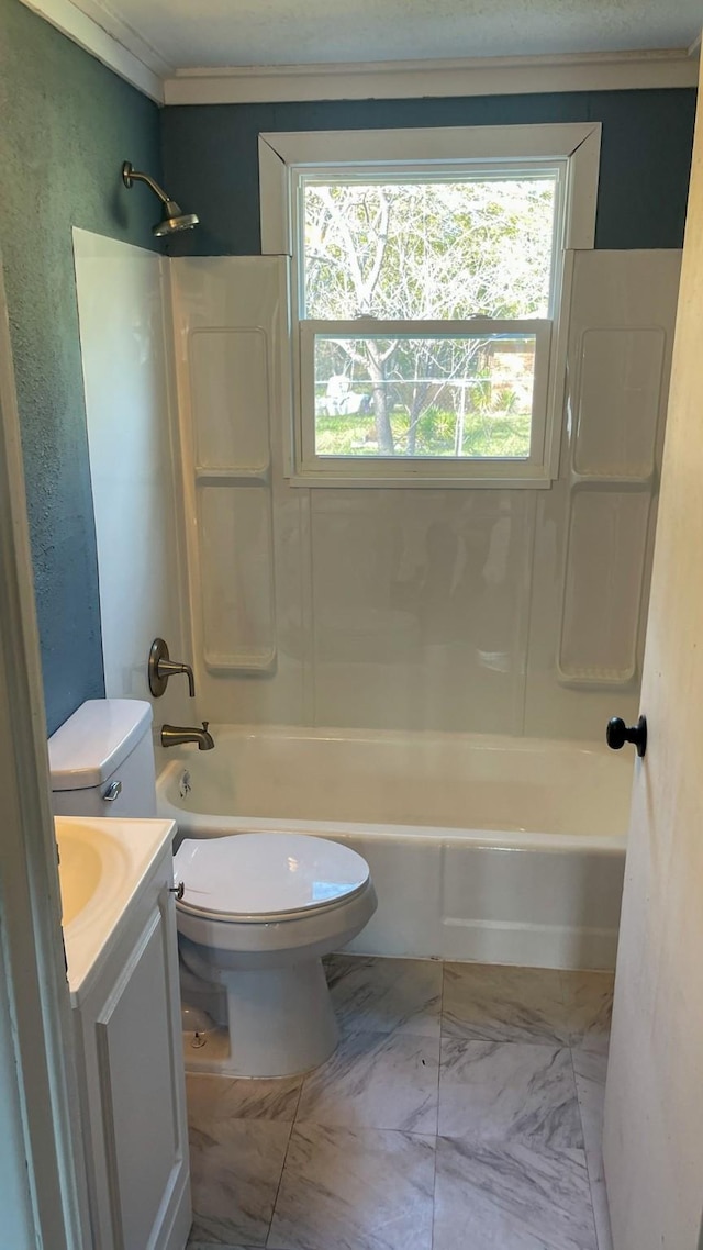 full bathroom featuring vanity,  shower combination, toilet, and ornamental molding