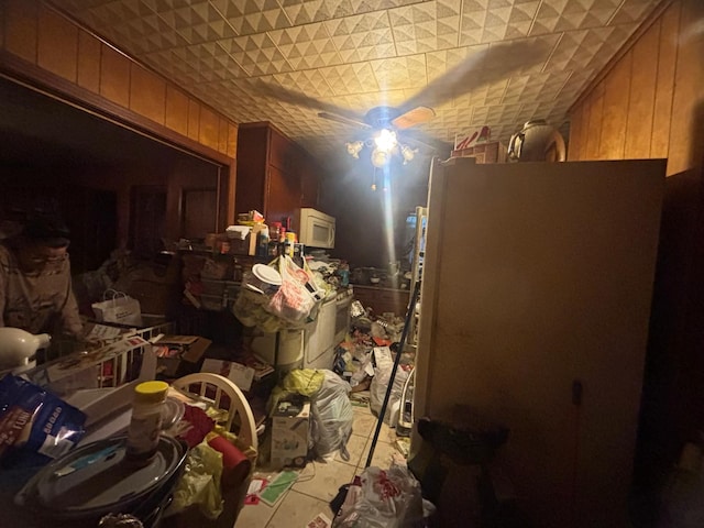 miscellaneous room featuring wooden walls