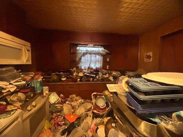 miscellaneous room featuring wooden walls