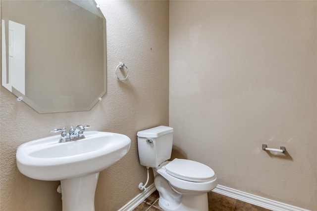 bathroom with tile patterned floors and toilet