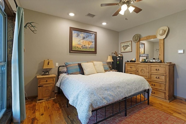 bedroom featuring hardwood / wood-style floors and ceiling fan