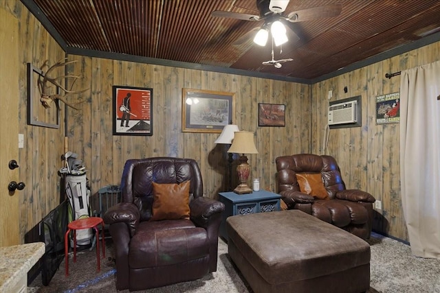 sitting room with a wall mounted air conditioner, ceiling fan, and carpet flooring