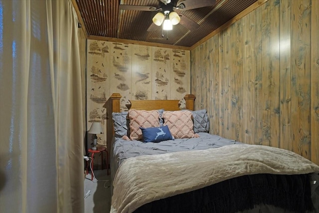 bedroom with wooden walls and wooden ceiling