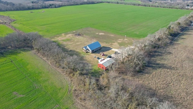 birds eye view of property with a rural view