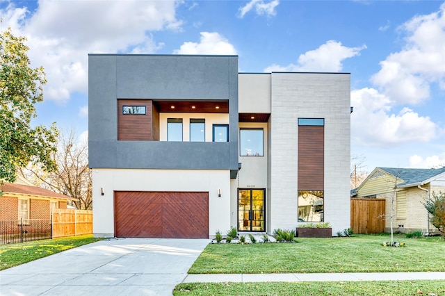 contemporary house with a front yard and a garage