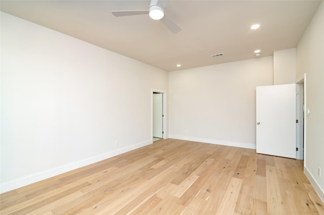 spare room with ceiling fan and light hardwood / wood-style flooring