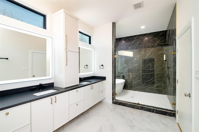 bathroom featuring vanity and plus walk in shower