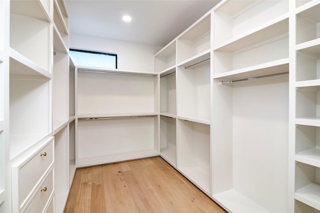 walk in closet featuring light hardwood / wood-style floors