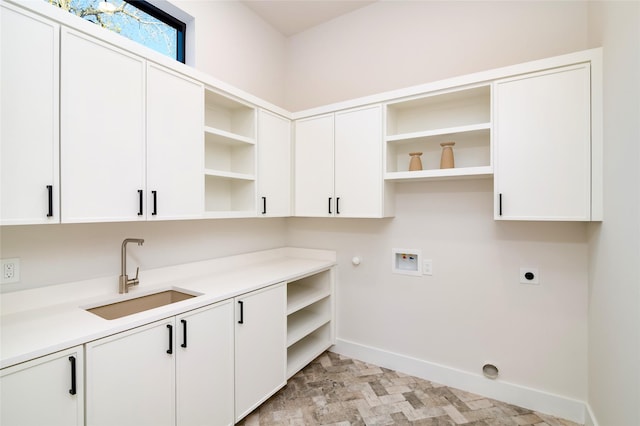 laundry area with cabinets, washer hookup, electric dryer hookup, sink, and hookup for a gas dryer