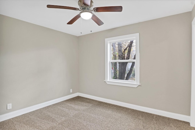 spare room featuring carpet floors and ceiling fan