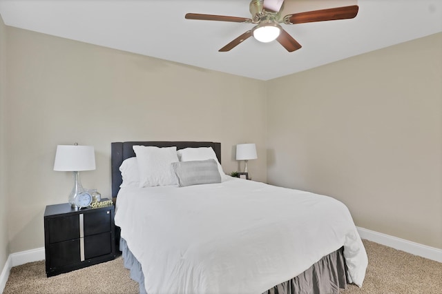 bedroom with ceiling fan and light carpet