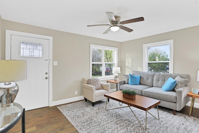 living room featuring hardwood / wood-style flooring and ceiling fan