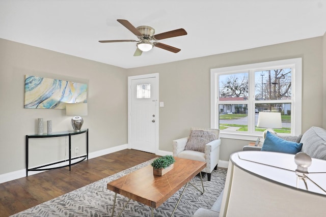 living room featuring hardwood / wood-style floors and ceiling fan