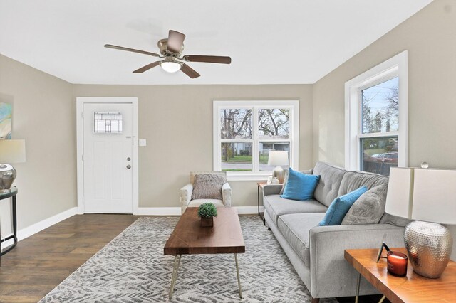 living room featuring hardwood / wood-style flooring and ceiling fan