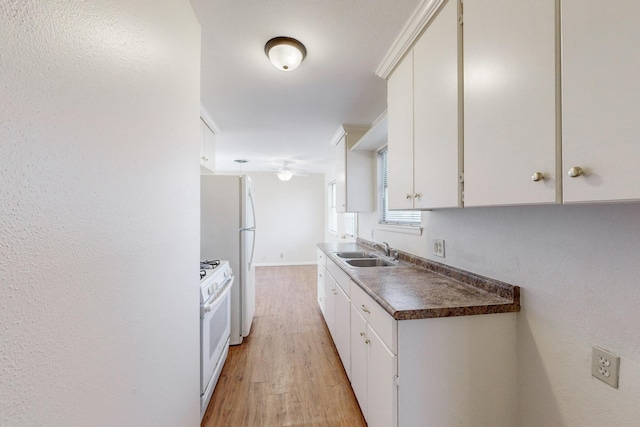 kitchen with white cabinetry, crown molding, white range with gas cooktop, sink, and light hardwood / wood-style flooring