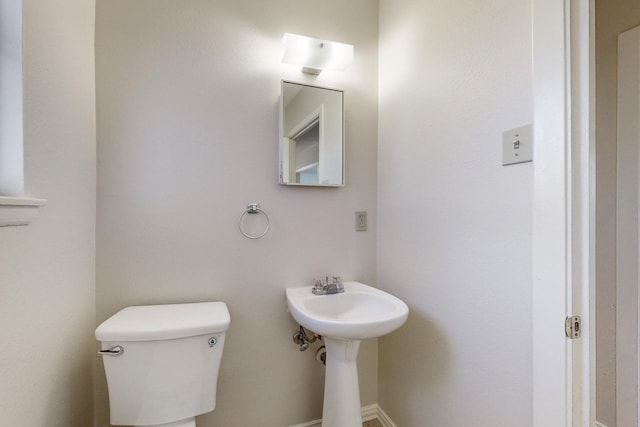 bathroom with sink and toilet