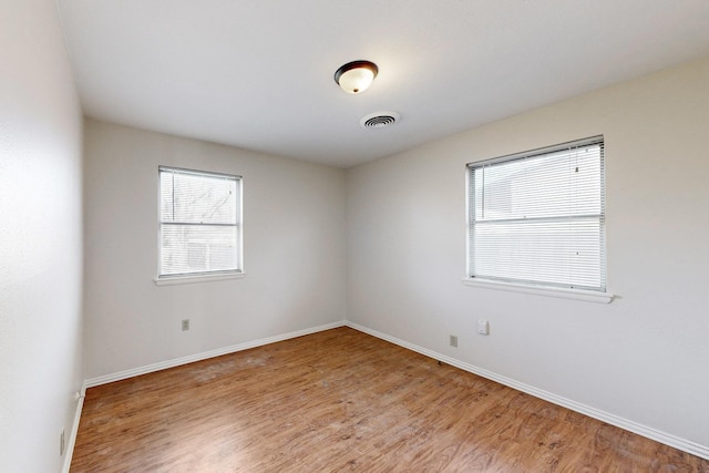 empty room with light wood-type flooring