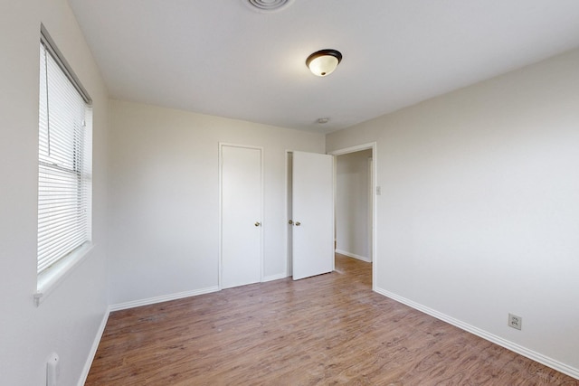 spare room featuring hardwood / wood-style floors