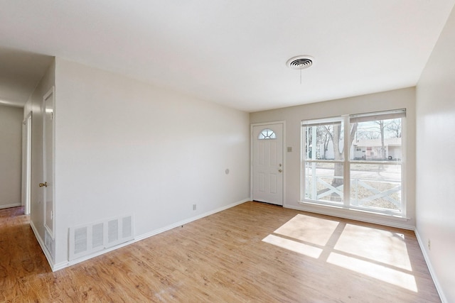 foyer with light hardwood / wood-style flooring