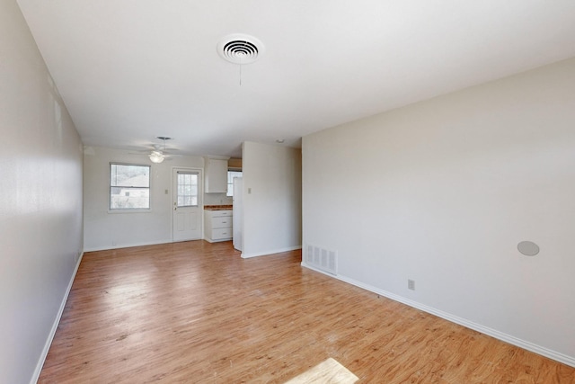 unfurnished living room featuring light wood-type flooring