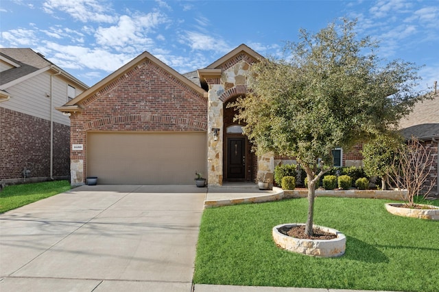 view of front of property with a garage and a front yard