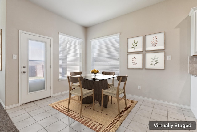 tiled dining area with a wealth of natural light