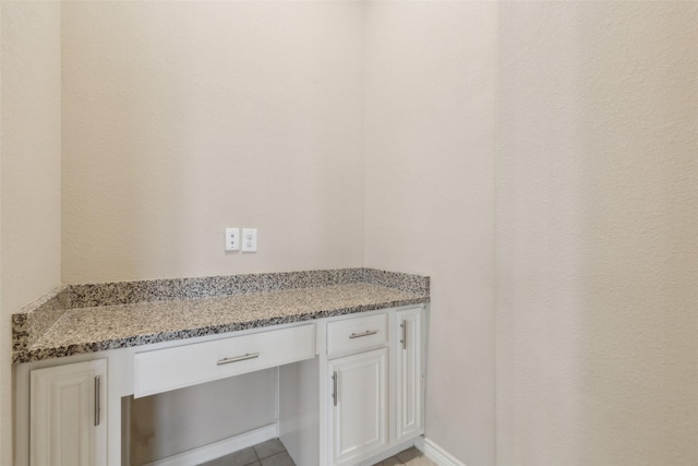 bathroom with tile patterned flooring and vanity