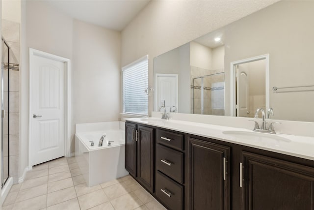 bathroom featuring tile patterned flooring, vanity, and independent shower and bath