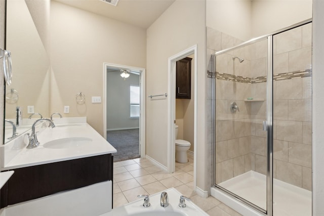 full bathroom featuring ceiling fan, tile patterned flooring, toilet, vanity, and independent shower and bath