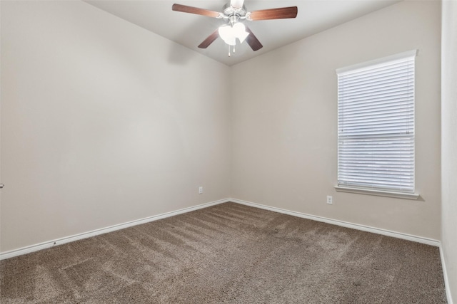 spare room with carpet and ceiling fan