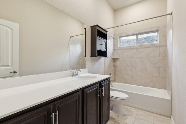 full bathroom featuring tile patterned floors, vanity, toilet, and tiled shower / bath combo