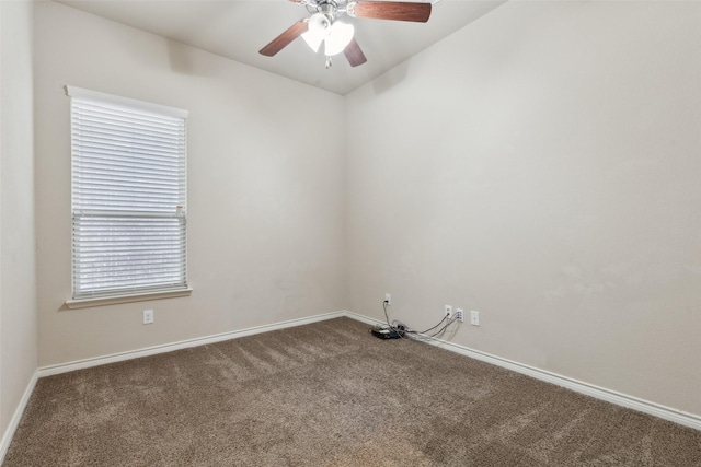 carpeted empty room featuring ceiling fan