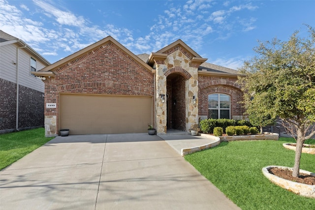 view of front of home featuring a garage and a front lawn