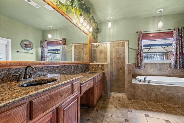 bathroom with separate shower and tub and vanity