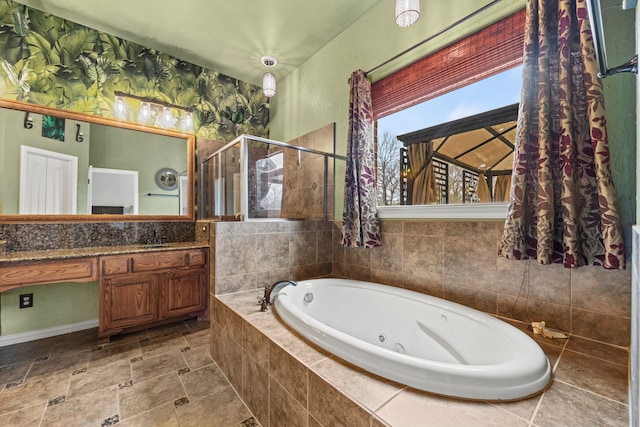 bathroom featuring vanity and shower with separate bathtub