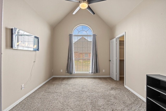 unfurnished room featuring ceiling fan, carpet floors, and lofted ceiling