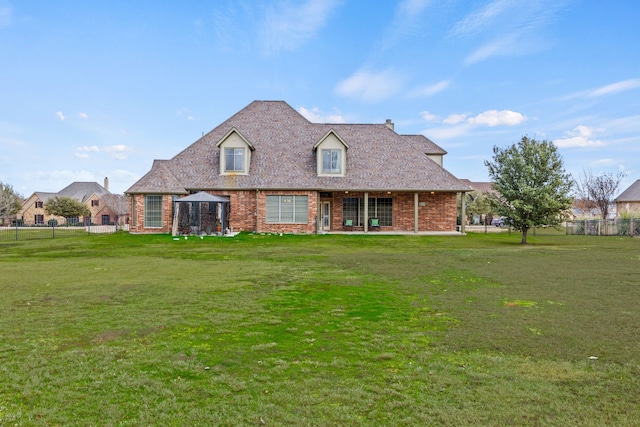 view of front facade featuring a patio and a front lawn