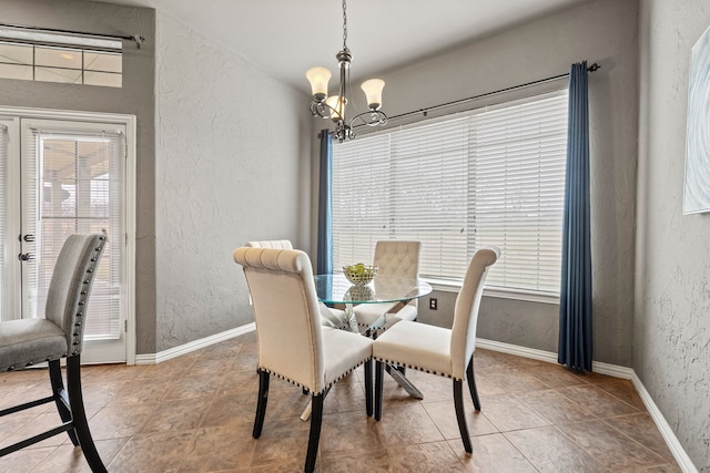 dining area featuring a chandelier