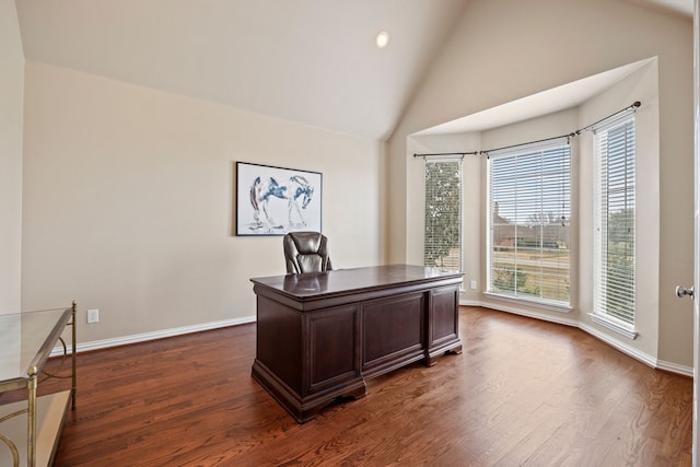 office space with dark wood-type flooring and high vaulted ceiling