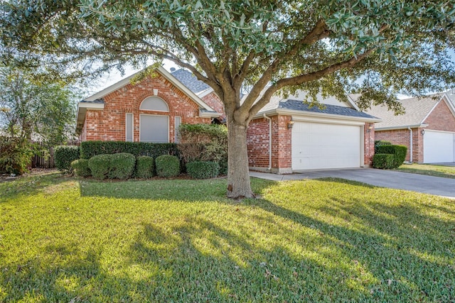 view of front of property featuring a garage and a front yard