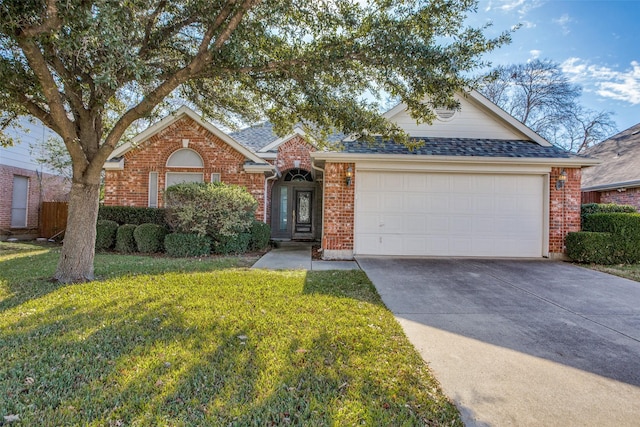 ranch-style house featuring a garage and a front lawn