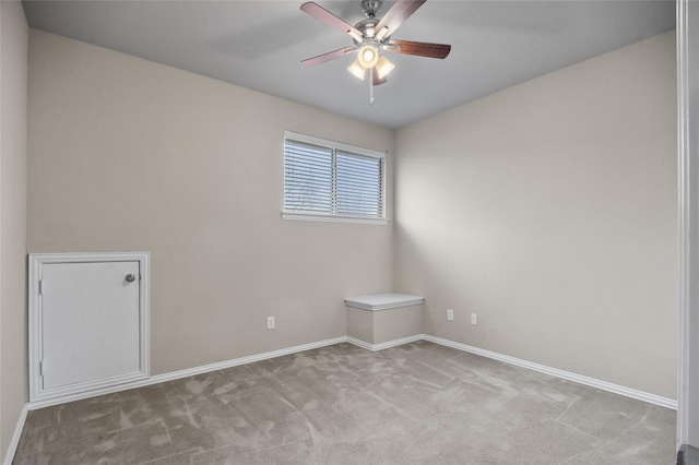 spare room with light carpet and ceiling fan