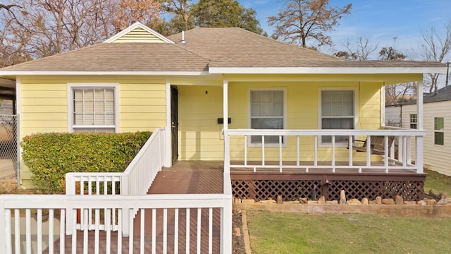 bungalow-style home with a porch and a front yard