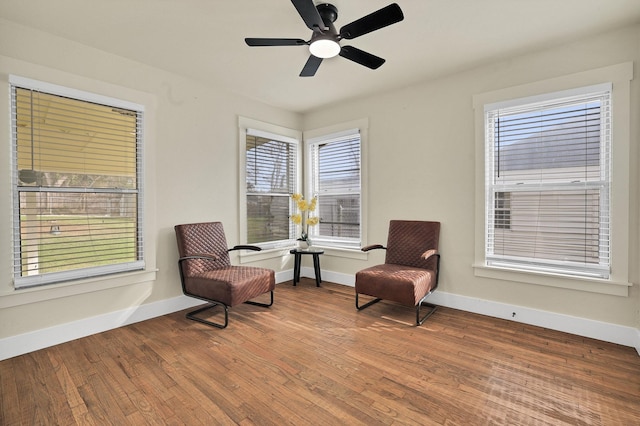 sitting room featuring hardwood / wood-style flooring, plenty of natural light, and ceiling fan