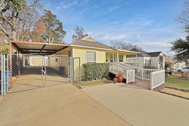 view of front facade featuring a porch and a carport